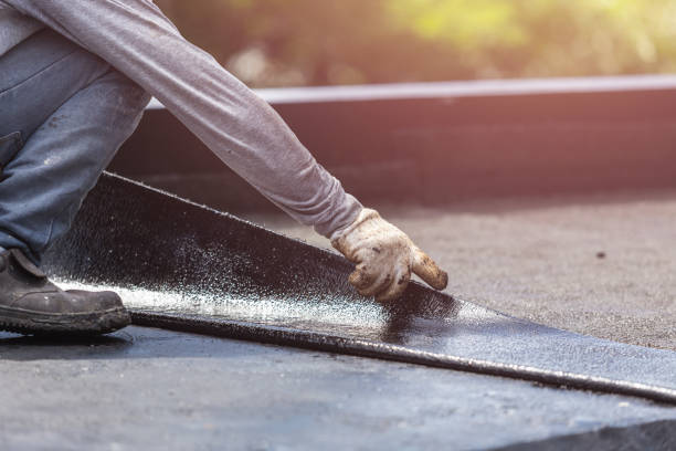 Professional Basement Waterproofing technician working in Londonderry, OH